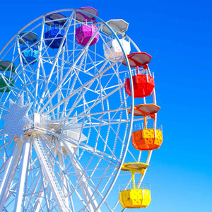 colorful ferris wheel with clear blue sky; https://cdn.shopify.com/videos/c/o/v/f5788316465845759dafc28b1edf20a8.mp4