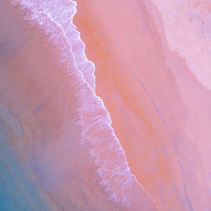 aerial view of blue waves crashing on pink sand beach; https://cdn.shopify.com/videos/c/o/v/f421cdb931a342429851adab19ececbb.mp4