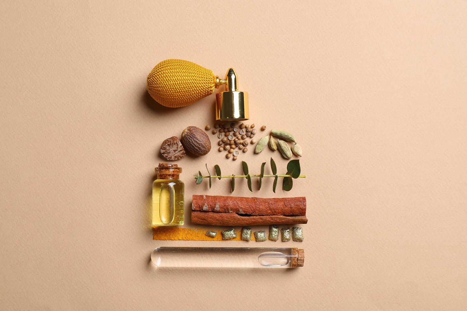 Bottle of luxury perfume and different ingredients on beige background, flat lay