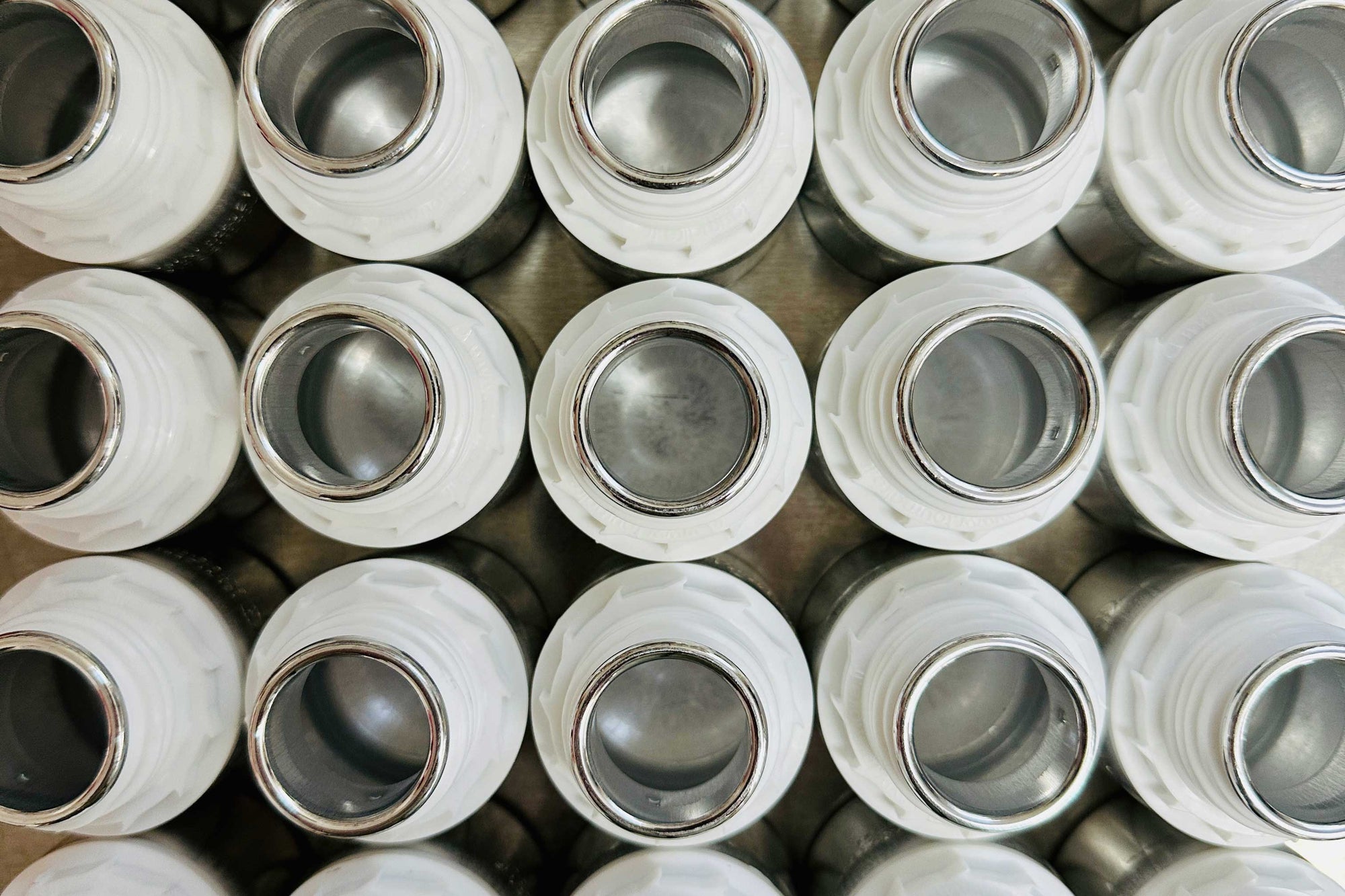 close up of stock fragrance aluminum fragrance oil bottles