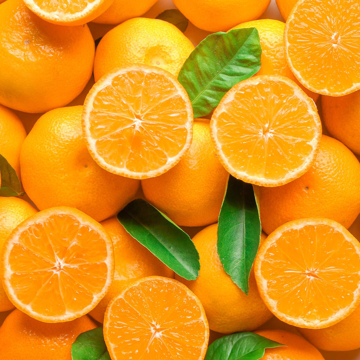 sliced and whole clementine fruit with leaves; https://cdn.shopify.com/videos/c/o/v/b994267b32684041bc13e58962464de9.mp4