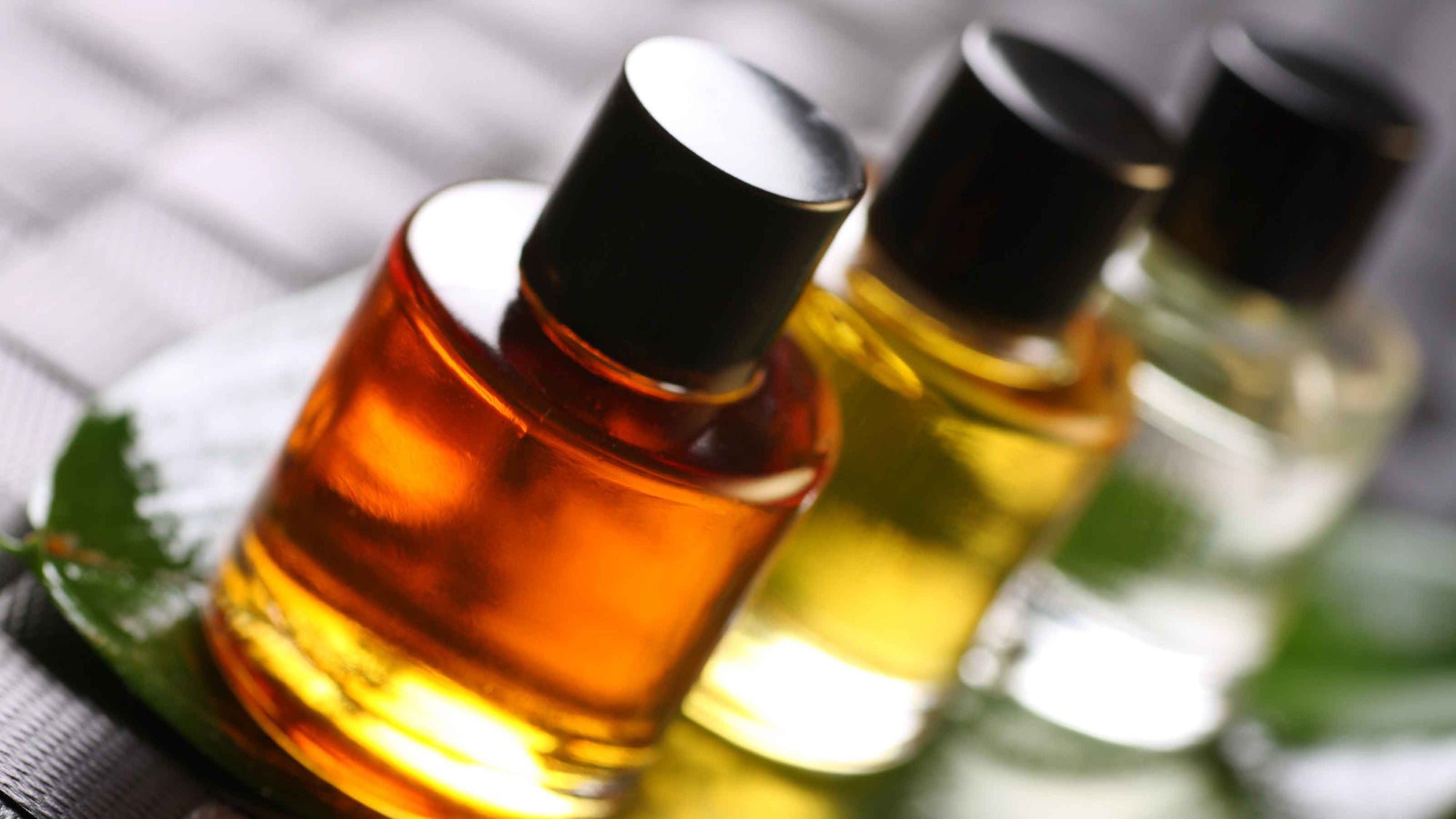 Test tubes with a dropper adding a drop of liquid, against a colorful blurred background