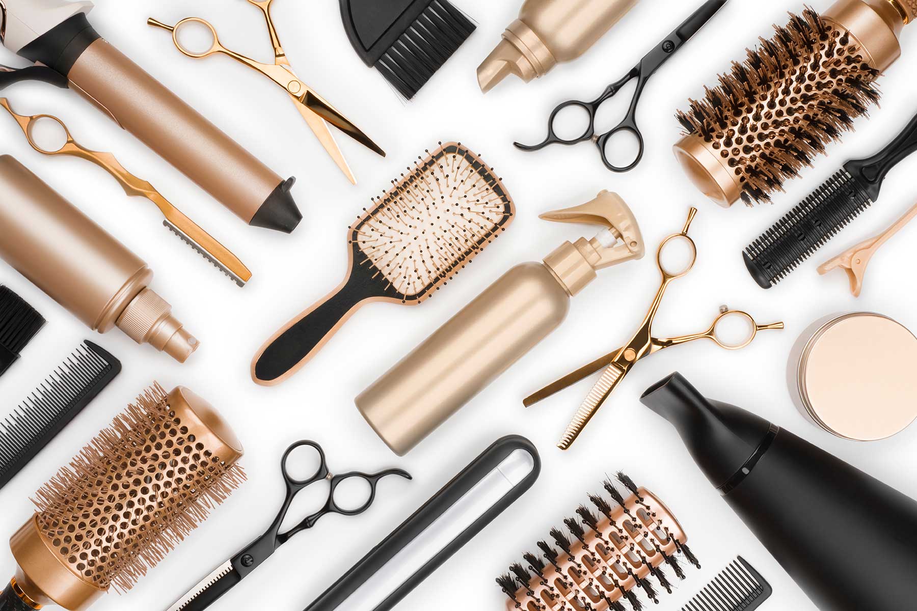 assorted hair brushes scissors and hair products