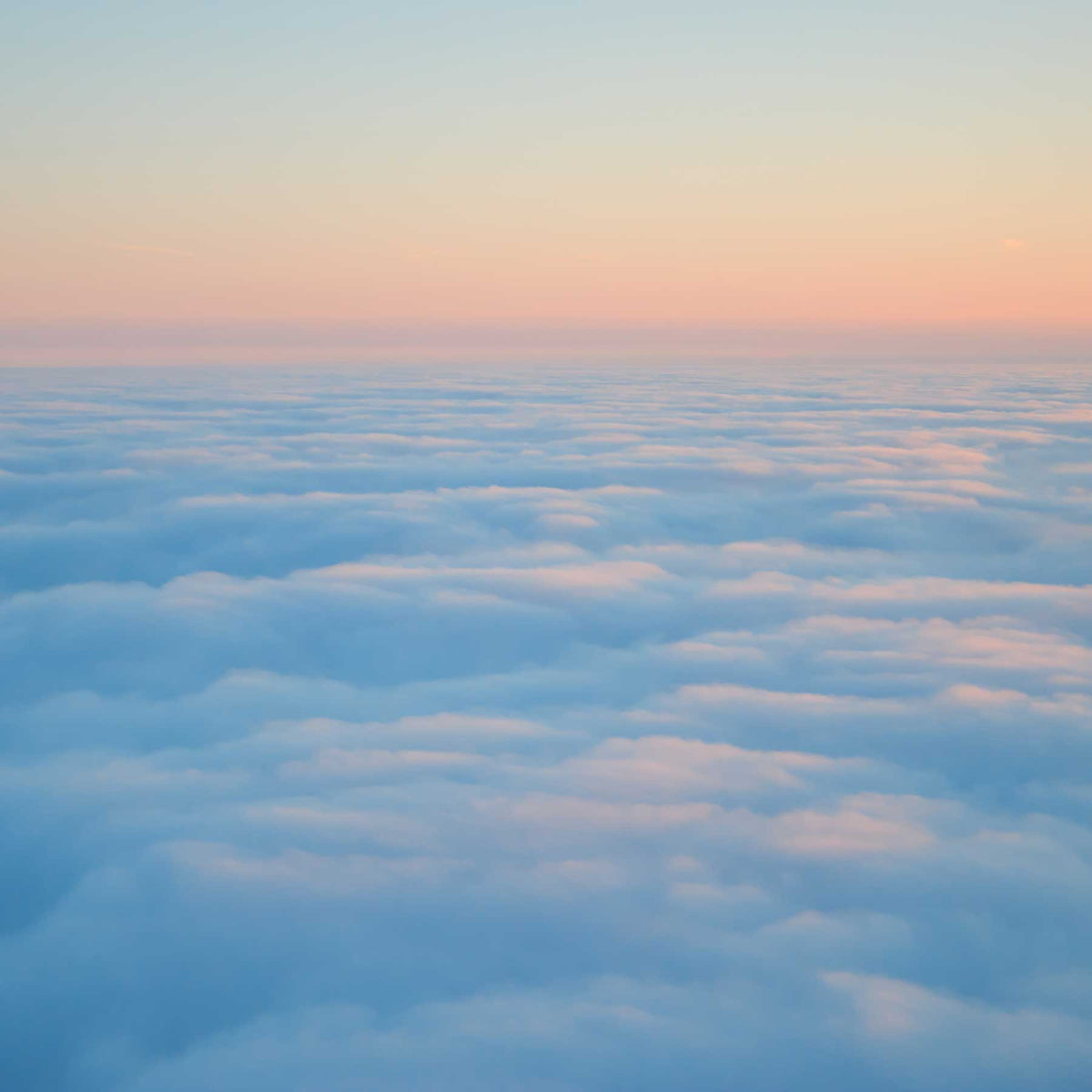 pastel color clouds as seen from airplane window; pink sunset over time lapse water surface; https://cdn.shopify.com/s/files/1/0457/0333/1991/files/Jetsetter.mp4?v=1644868582
