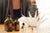 brown perfume bottles and perfume blotters with cecile in background