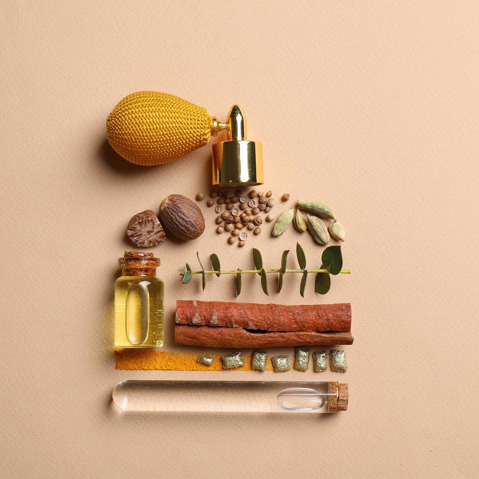 fragrant ingredients arranged in the shape of perfume bottle