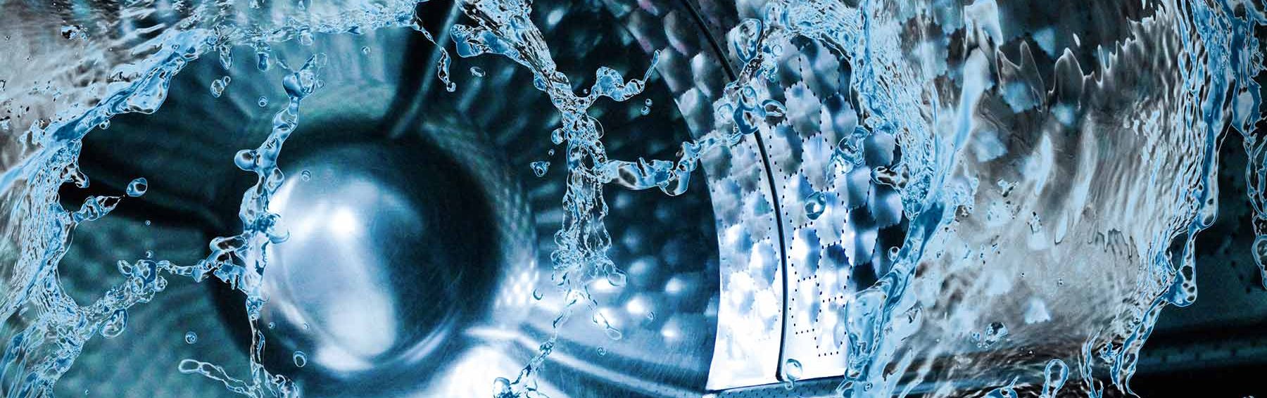 close up of washing machine drop with water