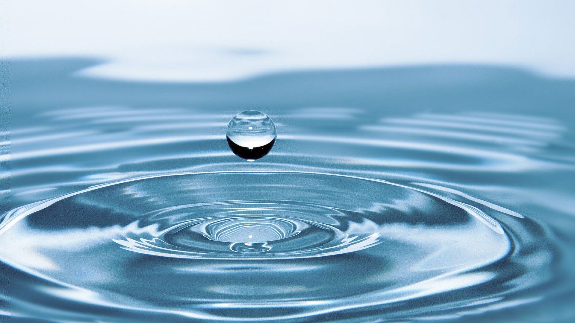 close up of water droplet and surface