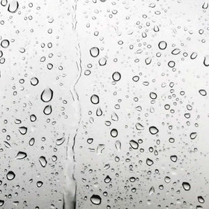 water droplets on a silver surface; https://cdn.shopify.com/s/files/1/0457/0333/1991/files/Fluid_Patchouli_0759f5ec-0cbc-432e-a13c-b8d932184ec0.mp4?v=1649182920