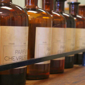 brown perfume bottles on shelf