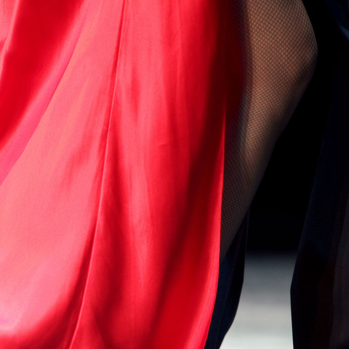 close up of woman&#39;s leg and red dress dancing; https://cdn.shopify.com/videos/c/o/v/d2d5452a7ef34d019126b0d1f5b26c12.mp4