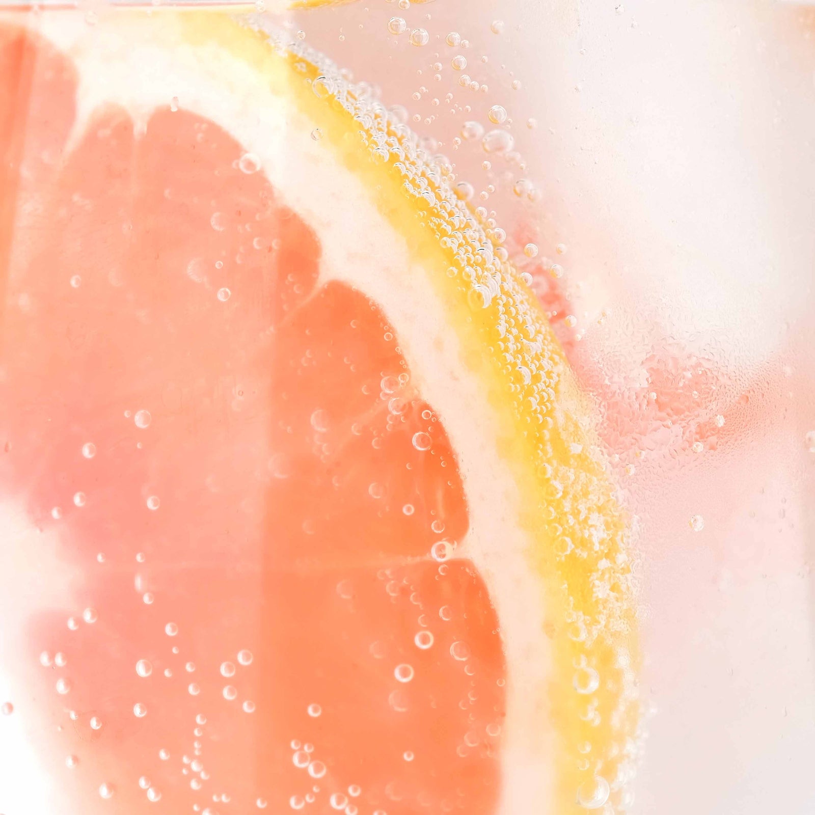 close up of pink grapefruit in sparkling water; https://cdn.shopify.com/videos/c/o/v/a39dcdd90d694a9fb48feded94767e11.mp4